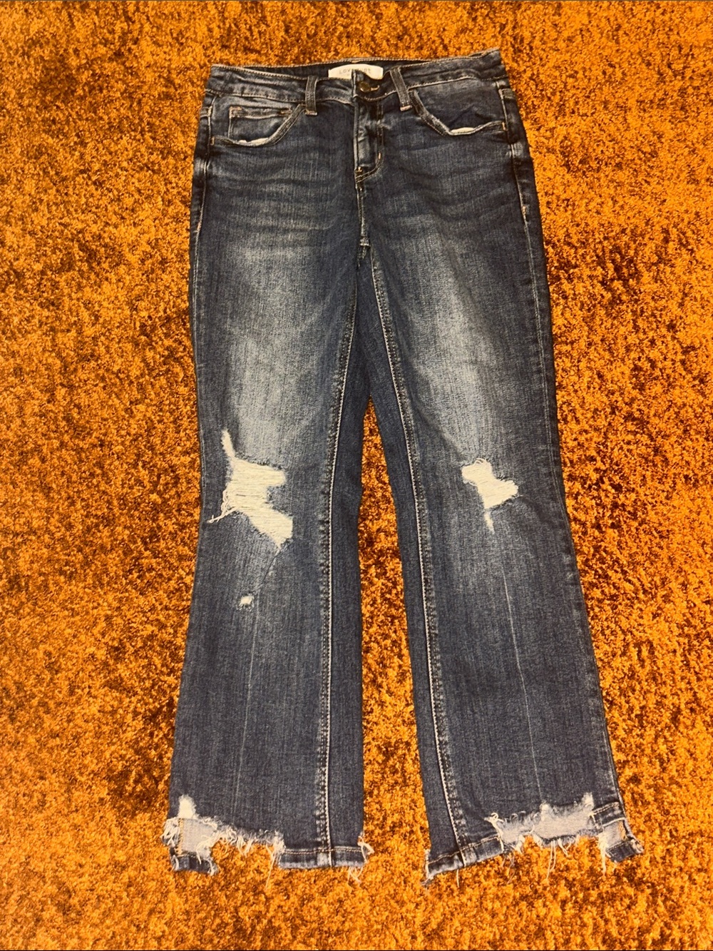 Distressed Dark Blue Flare Jeans with Raw Hem